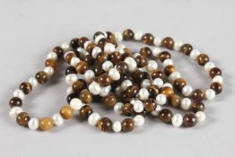 A LONG STRING OF TIGER'S EYE AND PEARLS. 4ft long.
