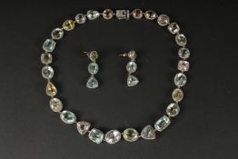 AN EXQUISITE MATCHING EARRINGS AND NECKLACE IN WHITE METAL set with aquamarines, morganite, heliodor