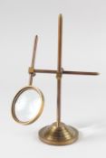 A MAGNIFYING GLASS on a stand.