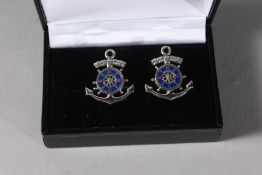 A SILVER ANCHOR AND SHIP'S WHEEL ENAMEL CUFFLINKS.