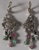 A PAIR OF SILVER EMERALD, RUBY AND SAPPHIRE ANGEL FISH EARRINGS.