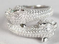 A SILVER DOUBLE PANTHER HEAD RING.