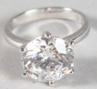 A SILVER SOLITAIRE CZ RING.