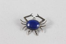 A SILVER AND LAPIS SPIDER BROOCH.