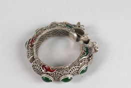 A DRAGON BANGLE. 3.5ins diameter.