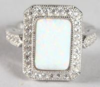 A SILVER OPAL DECO STYLE RING.