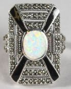A SILVER OPAL AND ONYZ DECO STYLE RING.