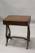 A GOOD REGENCY MAHOGANY WRITING TABLE with plain crossbanded top and fitted frieze drawer, with