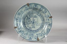 A CHINESE BLUE AND WHITE PORCELAIN CHARGER DISH, painted with various scenes of figures, 32cm