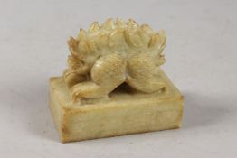 A CHINESE CARVED GREEN SOAPSTONE SEAL, formed as a two-headed beast, 8cm long.