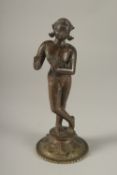 A RARE LARGE 16TH CENTURY OR EARLIER INDIAN BRONZE FIGURE OF FLUTING KRISHNA, (the base possibly