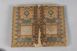 A FINE PERSIAN QAJAR LEATHER BOUND QURAN, with embossed cover and finely gilded illuminated pages,