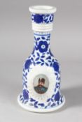 A 19TH CENTURY PERSIAN QAJAR MARKET RUSSIAN PORCELAIN HUQQA BASE, with portraits of a Persian ruler,