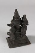 A FINE 18TH-19TH CENTURY SOUTH INDIAN BRONZE FIGURE OF A DEITY, with consort, 12.5cm high.
