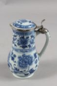 A FINE CHINESE BLUE AND WHITE PORCELAIN JUG WITH SILVER MOUNTED HINGED LID, with decorative floral