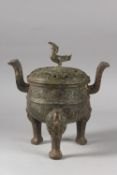 A CHINESE ARCHAIC STYLE BRONZE TWIN HANDLE TRIPOD CENSER, 28cm high.