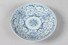 A 19TH CENTURY CHINESE BLUE AND WHITE PORCELAIN DISH, with floral motifs, the base with six-