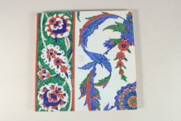 A LARGE TURKISH IZNIK GLAZED POTTERY TILE, 27cm square.