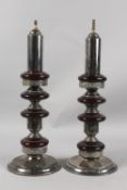 A VERY FINE PAIR OF CIRCULAR PLATED TABLE LAMP BASES, the columns inserted with possibly bakelite or