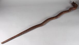 A CARVED DRAGON FORM WOODEN CANE, 98cm long.
