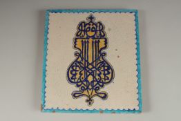 A FINE AND UNUSUAL 19TH CENTURY NORTH INDIAN MULTAN GLAZED POTTERY TILE, depicting stylised Arabic