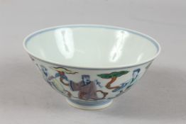 A CHINESE DOUCAI ENAMELLED PORCELAIN BOWL, painted with immortals, six-character mark to base, 15.