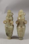 A PAIR OF CHINESE CARVED JADE LIDDED VASES, each with three ring handles to the neck and carved with
