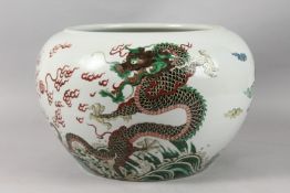 A LARGE CHINESE FAMILLE VERTE PORCELAIN JARDINIERE, finely painted with dragons and the flaming