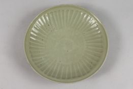 A CHINESE MING SWATOW CELADON GLAZED FLUTED DISH, applied sticker to base 'collection of Walter