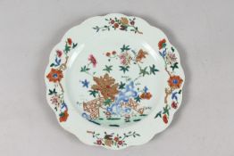 A FINE CHINESE POLYCHROME PORCELAIN SCALLOPED PLATE, with painted enamels depicting flora with