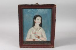 A FINE INDIAN PORTRAIT PAINTING, possibly on mica, framed and glazed, 30.5cm x 24.5cm overall.