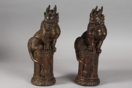 A PAIR OF CHINESE GILDED BRONZE DRAGONS, 25.5cm high.