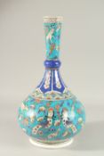 A LARGE TURKISH IZNIK GLAZED POTTERY VASE, painted with harpies and animals, 40cm high.