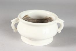 A CHINESE BLANC DE CHINE TWIN HANDLE CENSER, with impressed mark to base, 17cm handle to handle.
