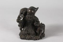 A BRONZE FIGURE OF SHOU LAO WITH DEER, 12cm high.