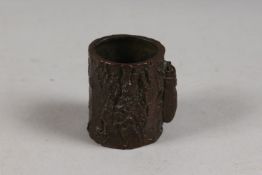 A BRONZE OKIMONO OF AN INSECT ON A TREE STUMP.