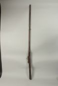AN 18TH CENTURY MUGHAL INDIAN MATCHLOCK RIFLE, with gold inlaid barrel and trigger.