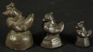 THREE BURMESE GRADUATED BRONZE OPIUM WEIGHTS, (3).