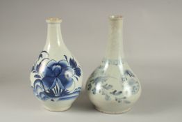TWO BLUE AND WHITE GLAZED PORCELAIN BOTTLES, 27cm high.