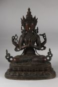 A VERY LARGE BRONZE SEATED DEITY ON A LOTUS BASE, 48cm high.