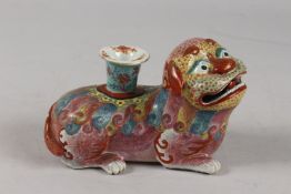 A VERY FINE CHINESE FAMILLE ROSE POTTERY KYLIN CANDLE HOLDER, 18cm long.