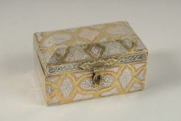 A FINE 19TH CENTURY DAMASCUS SILVER AND COPPER INLAID BRASS BOX, 10cm across.