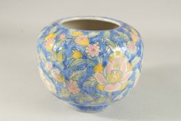 A FINE 19TH CENTURY PERSIAN QAJAR SIGNED MOULDED GLAZED POTTERY VASE, depicting hares and flora,