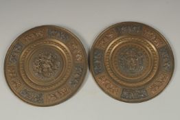 A PAIR OF 19TH CENTURY INDIAN TANJORE SILVER AND COPPER INLAID BRASS DISHES, depicting Hindu