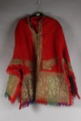 AN INDIAN KASHMIR EMBROIDERED DRESS COAT, with paisley designs and quilted satin lining, bearing