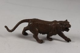 A BRONZE OKIMONO OF A TIGER.