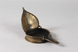 AN UNUSUAL INDIAN BRASS OIL LAMP, 18cm at widest point.