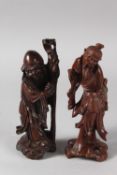 TWO 19TH CENTURY CHINESE CARVED WOOD FIGURES, each approx. 21cm high.