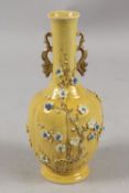 A CHINESE QING DYNASTY YELLOW GROUND PORCELAIN VASE, with carved relief prunus blossom and ornate