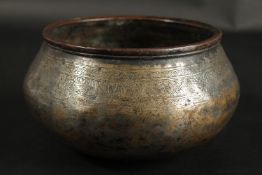 A RARE 14TH-15TH CENTURY ISLAMIC ENGRAVED TINNED COPPER BOWL, with calligraphy and Arabesque